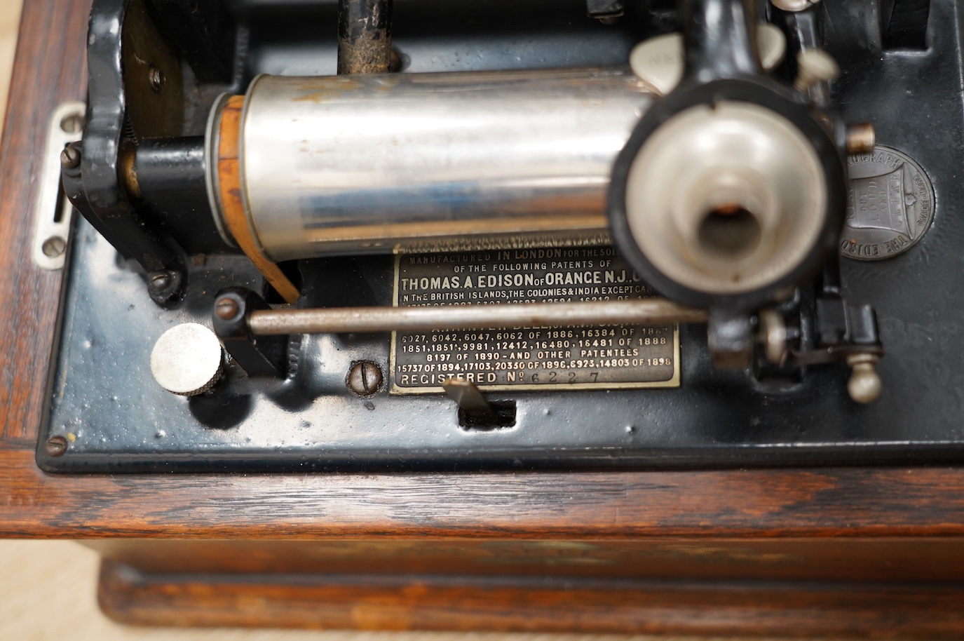 An oak cased Edison phonograph with ten rolls and a small table top polyphon with twelve 8 inch discs (2). Condition - fair to good.